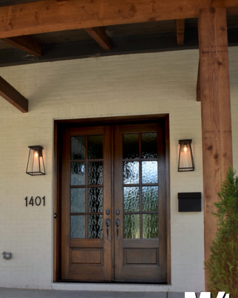 M4 mahogany double entry door with textured glass, under a timber-framed porch